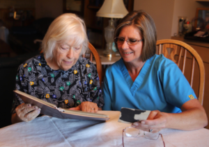 IMG_3905 Home care caregiver assisting senior client - Devoted 2U Home Care